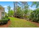 Scenic backyard view with lush landscaping and pond creating a peaceful and private setting at 1315 Cherry Dr., Surfside Beach, SC 29575