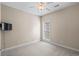Cozy bedroom with neutral walls, carpet, ceiling fan, and a TV mounted on the wall at 1315 Cherry Dr., Surfside Beach, SC 29575