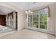 Bright dining area with tile flooring, large windows and chandelier at 1315 Cherry Dr., Surfside Beach, SC 29575