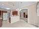 Open concept dining area leading to kitchen with wood cabinets and modern appliances at 1315 Cherry Dr., Surfside Beach, SC 29575