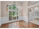 Elegant dining area featuring a chandelier and large windows at 1315 Cherry Dr., Surfside Beach, SC 29575