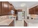 Modern kitchen with wood cabinets, updated appliances, and a convenient breakfast bar at 1315 Cherry Dr., Surfside Beach, SC 29575