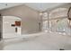 Open-concept living room with high ceilings, arched doorways, and seamless transition to the kitchen at 1315 Cherry Dr., Surfside Beach, SC 29575