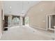 Expansive living room featuring carpet floors, fireplace, and French doors leading to the outside at 1315 Cherry Dr., Surfside Beach, SC 29575