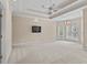 Spacious primary bedroom featuring tray ceiling, recessed lighting, chandelier, and plentiful windows at 1315 Cherry Dr., Surfside Beach, SC 29575