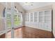 Well-lit office featuring custom built-in shelving, hardwood floors, and a large window at 1315 Cherry Dr., Surfside Beach, SC 29575