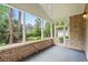 Relaxing screened porch with brick accents, ceiling fan and tranquil water view and entrance to the back yard at 1315 Cherry Dr., Surfside Beach, SC 29575