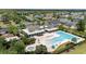 Aerial view featuring the community pool, lounge area, and neighboring pond at 1325 Bermuda Grass Dr., Myrtle Beach, SC 29579