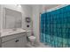 Bathroom with gray walls, a vanity, and a blue shower curtain at 1325 Bermuda Grass Dr., Myrtle Beach, SC 29579