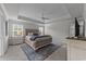 Spacious bedroom boasts tray ceilings, large windows, and stylish decor at 1325 Bermuda Grass Dr., Myrtle Beach, SC 29579