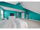 Bright bedroom with teal walls, vaulted ceilings, carpet, and ceiling fan at 1325 Bermuda Grass Dr., Myrtle Beach, SC 29579