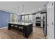 Modern kitchen with large island, pendant lighting, stainless steel appliances, and ample counter space at 1325 Bermuda Grass Dr., Myrtle Beach, SC 29579