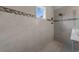Tiled shower featuring neutral colors and a glass partition at 1325 Bermuda Grass Dr., Myrtle Beach, SC 29579