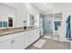 Elegant bathroom featuring a double sink vanity, granite countertops, and glass enclosed shower at 1340 Jolly Roger Dr., North Myrtle Beach, SC 29582