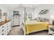 Bright bedroom with four-poster bed and white furniture at 1340 Jolly Roger Dr., North Myrtle Beach, SC 29582