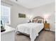 Cozy bedroom with flamingo pillows and natural light at 1340 Jolly Roger Dr., North Myrtle Beach, SC 29582