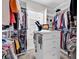 Organized walk-in closet with custom shelving and central dresser at 1340 Jolly Roger Dr., North Myrtle Beach, SC 29582