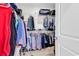 Walk-in closet with metal shelving filled with clothes and accessories at 1340 Jolly Roger Dr., North Myrtle Beach, SC 29582