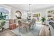 Bright dining room featuring stylish furnishings, chandelier, and a sliding glass door to the outdoor patio at 1340 Jolly Roger Dr., North Myrtle Beach, SC 29582