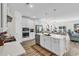 Bright kitchen featuring stainless steel appliances, a central island, and an open layout to the living spaces at 1340 Jolly Roger Dr., North Myrtle Beach, SC 29582
