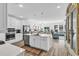 Open-concept kitchen with a large island, stainless steel appliances, and seamless flow into the dining and living areas at 1340 Jolly Roger Dr., North Myrtle Beach, SC 29582