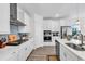 Modern kitchen with stainless steel appliances, white cabinetry, subway tile backsplash, and ample counter space at 1340 Jolly Roger Dr., North Myrtle Beach, SC 29582
