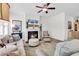 Inviting living room featuring a cozy fireplace, plush seating, and plenty of natural light at 1340 Jolly Roger Dr., North Myrtle Beach, SC 29582