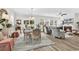 Bright and airy living room with a fireplace, dining area, comfortable seating, and large windows for natural light at 1340 Jolly Roger Dr., North Myrtle Beach, SC 29582