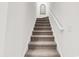 Carpeted staircase with white railings and walls at 1340 Jolly Roger Dr., North Myrtle Beach, SC 29582