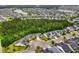 Community aerial view showcasing homes nestled amongst mature trees with nearby ponds and meticulous landscaping at 1444 Thames Ct., Myrtle Beach, SC 29577