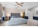 Comfortable bedroom with large bed, ceiling fan and an accent wall at 1444 Thames Ct., Myrtle Beach, SC 29577