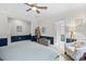 Bedroom with a walk-in bathroom, accent walls, natural light, and neutral carpeting at 1444 Thames Ct., Myrtle Beach, SC 29577