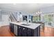 Kitchen with center island, stainless appliances, and an open floor plan into the dining and living room at 1444 Thames Ct., Myrtle Beach, SC 29577