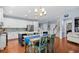 Open floor plan with an eat-in kitchen featuring stainless appliances and island seating at 1444 Thames Ct., Myrtle Beach, SC 29577