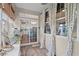 Sunroom with tile floors, bright windows, access to kitchen and outdoor views at 1444 Thames Ct., Myrtle Beach, SC 29577