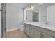 Bathroom featuring double vanity with modern lighting, a toilet, and tiled walk-in shower at 1533 Coastal Cove Ln, Calabash, NC 28467