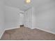 Bedroom view showcasing neutral walls, carpeting, and a closet with doors at 1533 Coastal Cove Ln, Calabash, NC 28467