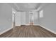 Spacious bedroom with plank flooring, a tray ceiling, a ceiling fan, and ample natural light at 1533 Coastal Cove Ln, Calabash, NC 28467