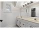 Charming bathroom with double vanity, wainscoting, decorative window, and classic fixtures at 1533 Murrells Landing Rd., Conway, SC 29526