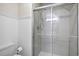 Contemporary bathroom features a modern glass-enclosed shower and neutral tilework at 1533 Murrells Landing Rd., Conway, SC 29526