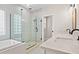 Bathroom with a glass shower, soaking tub, and double sink vanity with white countertops at 1533 Murrells Landing Rd., Conway, SC 29526