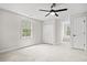 Inviting bedroom with neutral carpet, ceiling fan, double closet, and natural light from large window at 1533 Murrells Landing Rd., Conway, SC 29526