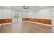 Spacious bonus room with wood paneling and sliding glass doors to the outside at 1533 Murrells Landing Rd., Conway, SC 29526