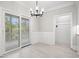 Elegant dining room with sliding glass doors and stylish lighting fixture at 1533 Murrells Landing Rd., Conway, SC 29526