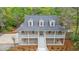 Captivating aerial view of home featuring a dormered roof, inviting porch, and lush landscaping at 1533 Murrells Landing Rd., Conway, SC 29526