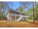 Stunning home exterior featuring a large screened-in porch, multi-level decks, and well-manicured yard at 1533 Murrells Landing Rd., Conway, SC 29526