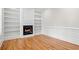 Inviting living room with hardwood floors, a fireplace, and built-in bookshelves at 1533 Murrells Landing Rd., Conway, SC 29526