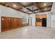 Spacious room featuring wood-paneled walls, coffered ceiling, and built-in cabinets with a microwave at 1533 Murrells Landing Rd., Conway, SC 29526