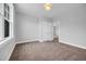 This empty bedroom has natural light, neutral walls, and carpeting at 1549 Coastal Cove Ln, Calabash, NC 28467