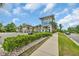 Beautiful clubhouse with a coastal aesthetic, lush landscaping, and plenty of parking at 1549 Coastal Cove Ln, Calabash, NC 28467